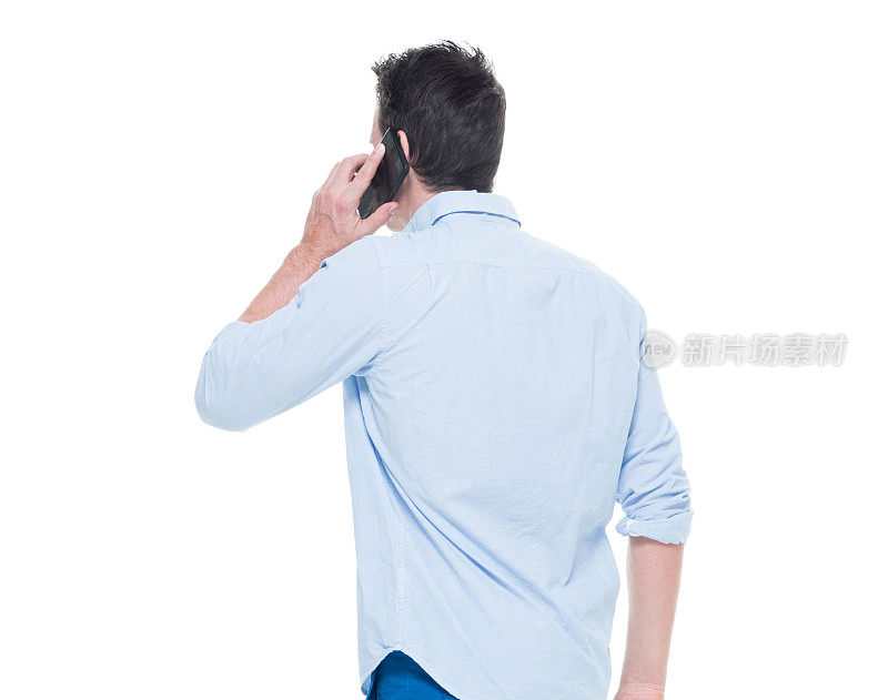 One man only / one person / waist up / front view of 20-29 years old adult handsome people caucasian male / young men standing wearing button down shirt / shirt who is smiling / happy / cheerful / talking / cool attitude and holding mobile phone